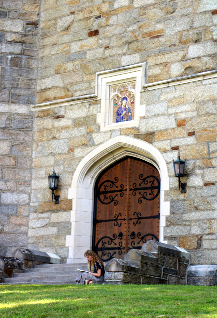 A student studies at the Chapel entrance