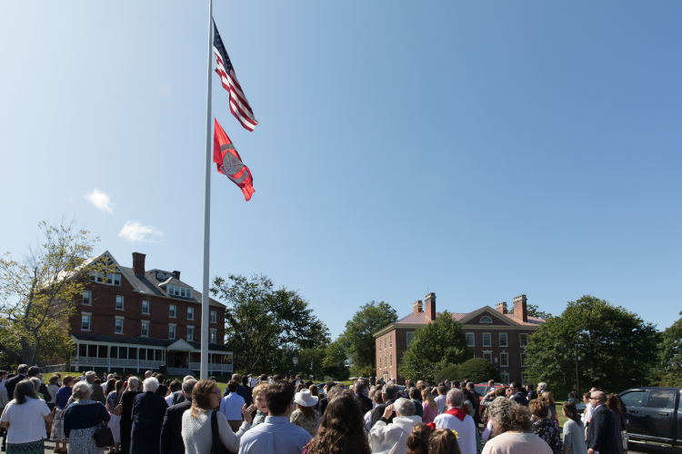 Raising the flags at the first Convocation on the New England campus (2019)