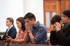 Students praying in the California Chapel