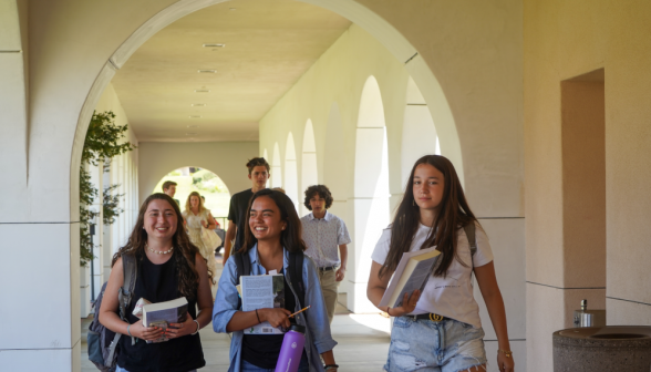 Students walk along the academic quadrangle