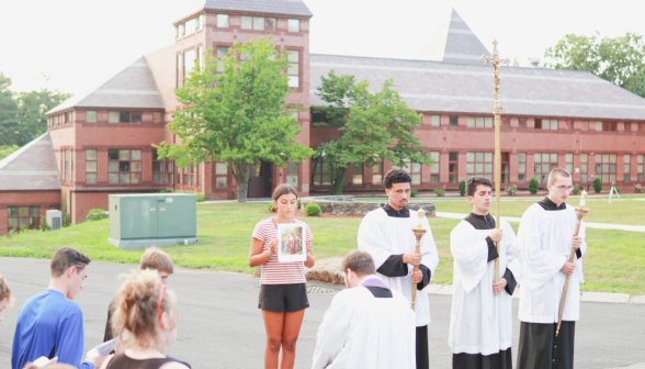 Students pray the Stations of the Cross