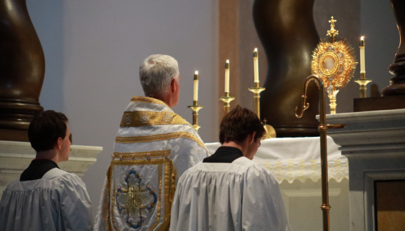 Fr. Walshe says Benediction