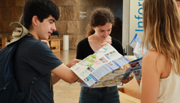 Students study the map