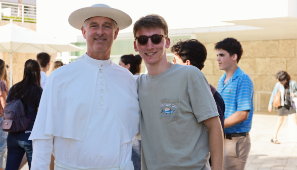 Fr. Walshe poses with a student