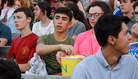 Students eat popcorn