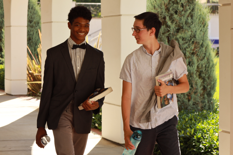 Students walk along the academic quadrangle