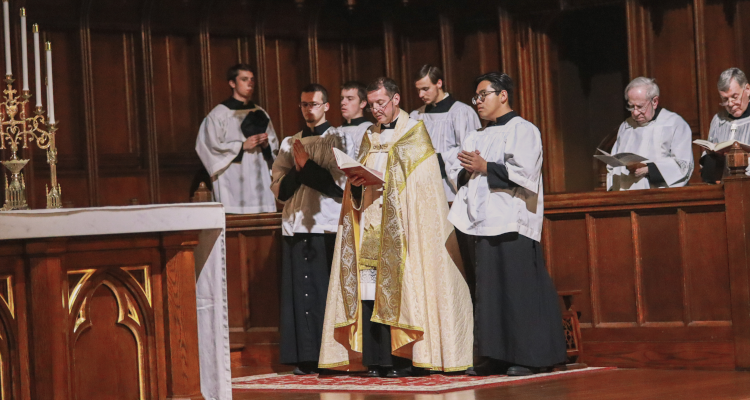 Fr. Markey reads a lesson at the Advent Lessons and Carols