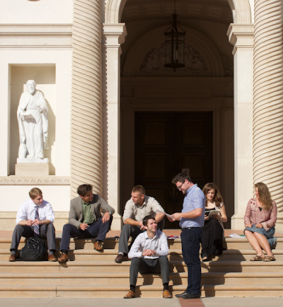 Students sitting in front of Our Lady of the Most Holy Trinity Chapel