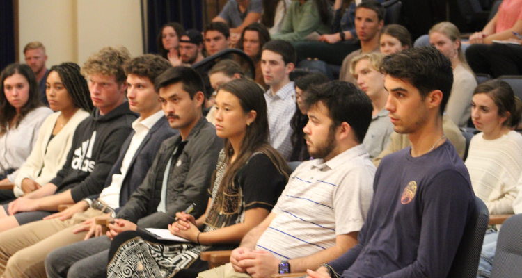 The gathered students listen to the panelists