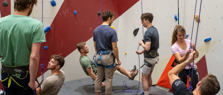 Students try out the rock-climbing equipment