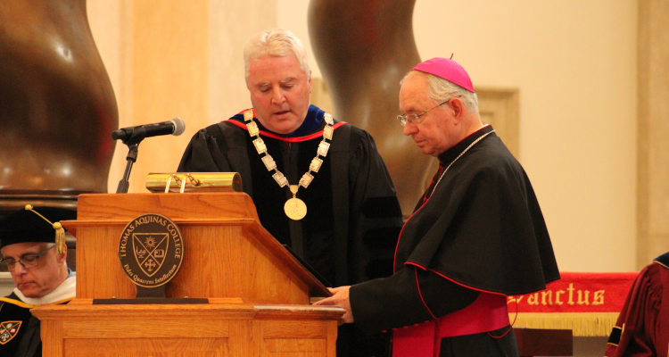 Archbishop Jose H. Gomez leads Dr. Paul J. O'Reilly ('84) in the Oath of Office