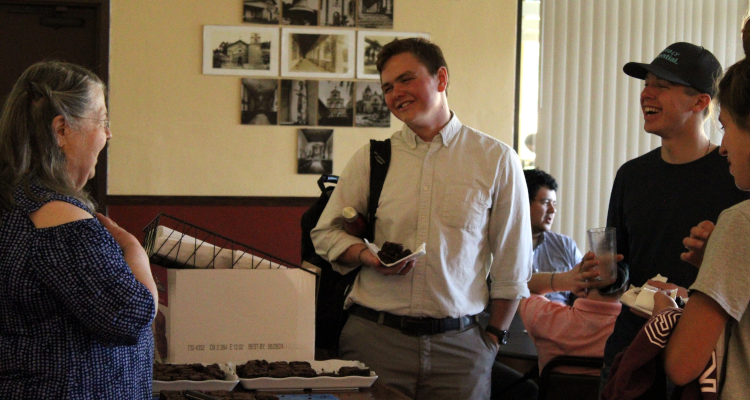 The Banana Bread Lady chats with students over the brownies