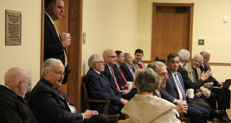 The audience listens to the panelists