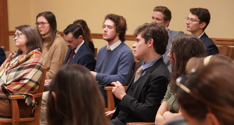 Students listen to a presentation