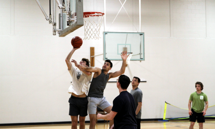 Students play basketball