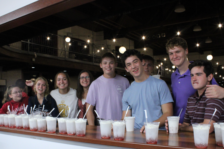 A row of students at the Coffee Shop counter, afront a row of Italian sundaes