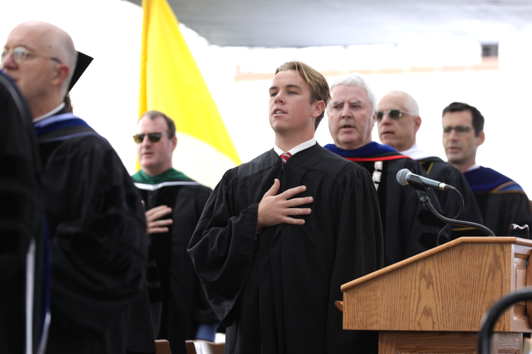 Patrick Daly (CA'26) gives the Pledge of Allegiance