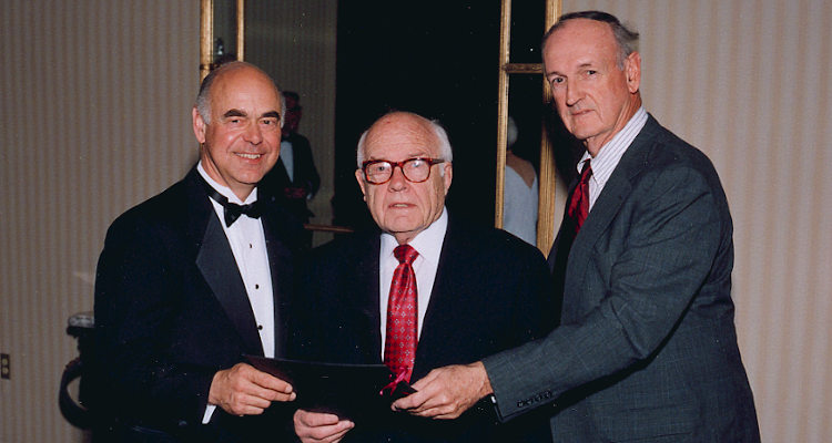 The first member of the College’s Board of Governors, John E. Schaeffer (center), is shown here being honored in 2000 with founding tutor John W. Neumayr (right) and then-President Thomas E. Dillon (left).