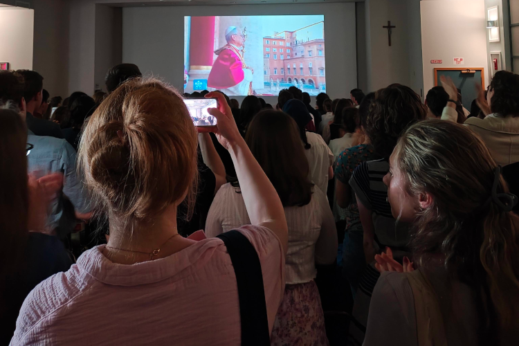 Students celebrate the elevation of Pope Leo XIV