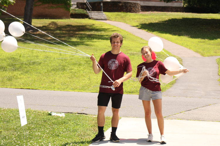 Prefects welcome arrivals with balloons