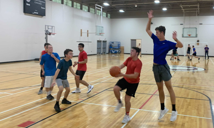 Students play basketball