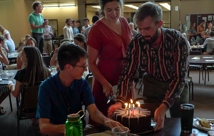 A student receives a birthday cake