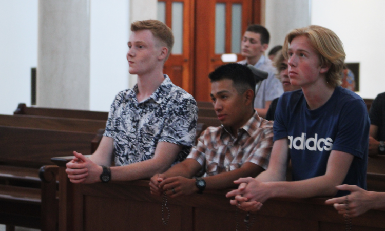 Students pray the Rosary in the Chapel