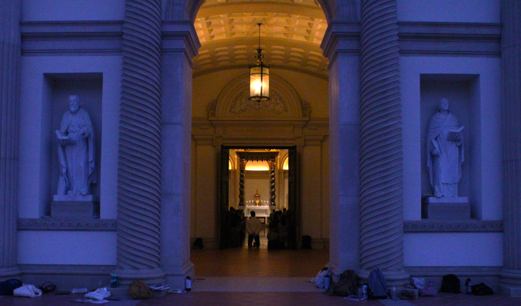 View through the Chapel doors: students pray before the exposed Sacrament