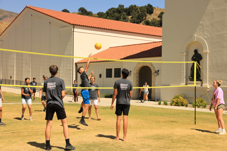Students play volleyball
