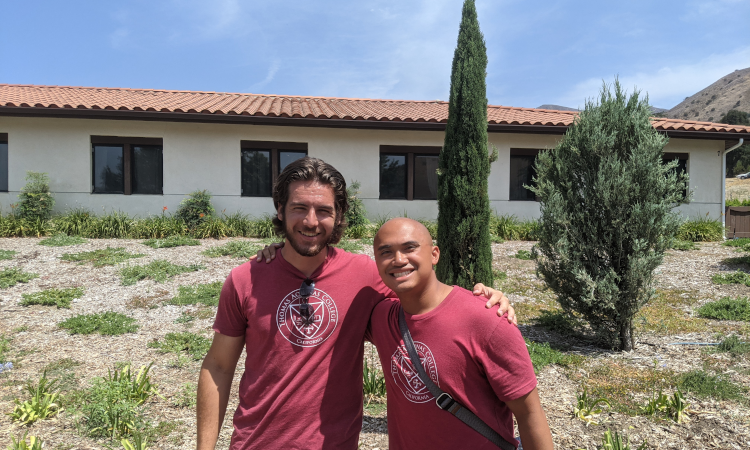 Two Summer Program prefects pose in front of one of the dorms