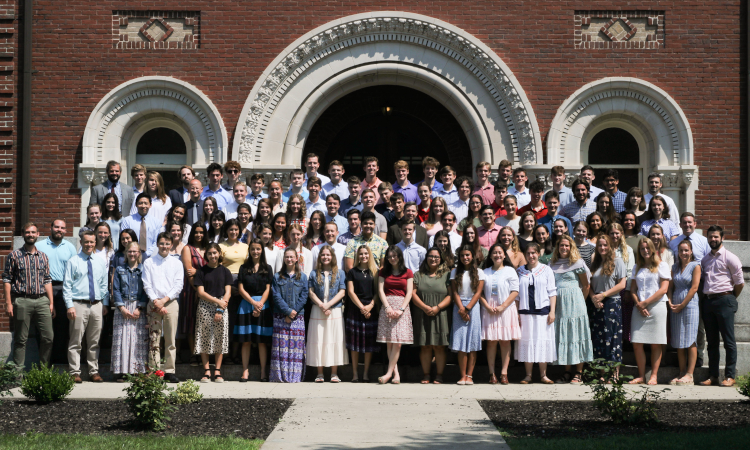 All students pose for a group photo with the tutors