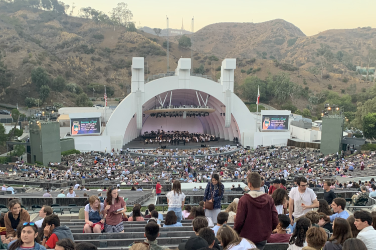 Students in the benches at the Hollywood Bowl, waiting for the light to go down