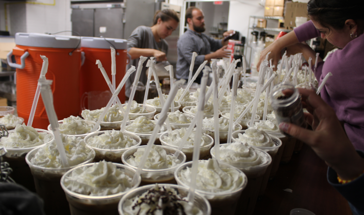 The prefects prepare dozens upon dozens of iced mochas at the coffee shop counter