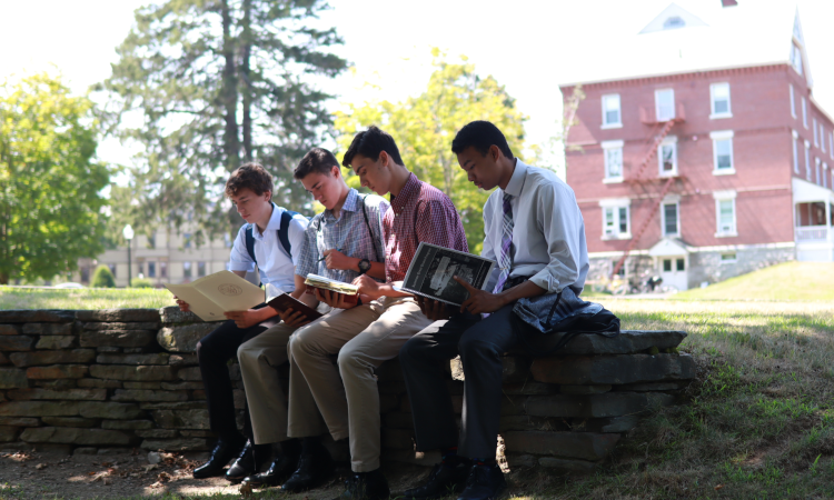 Students study on the stone ring by Merrill-Keep
