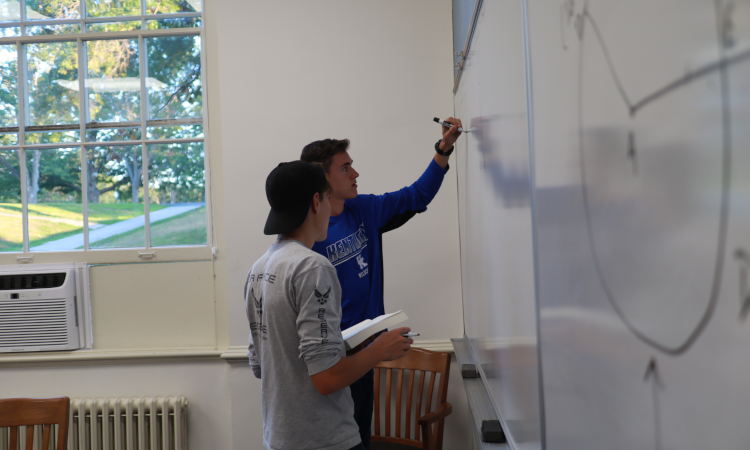 Two practicing props at the board