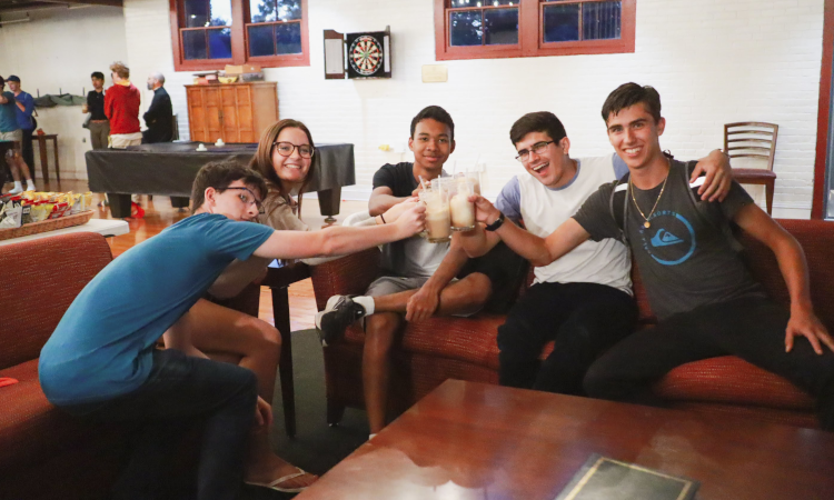 Students clink their root beer floats