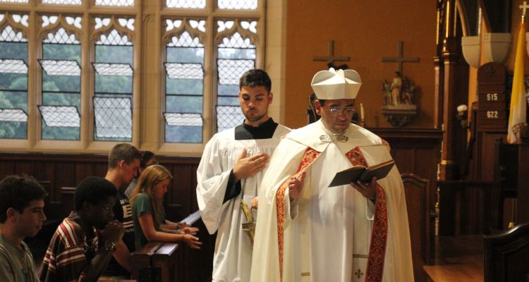 Fr. Miguel blesses the scapulars