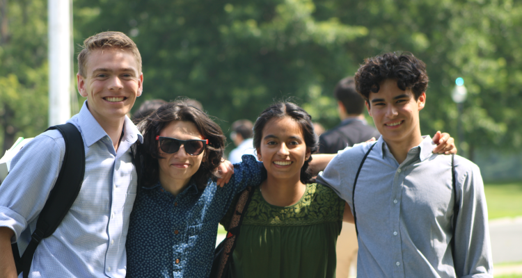 Four pose for a photo