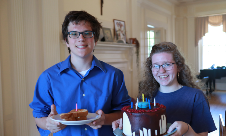Students with birthday cakes