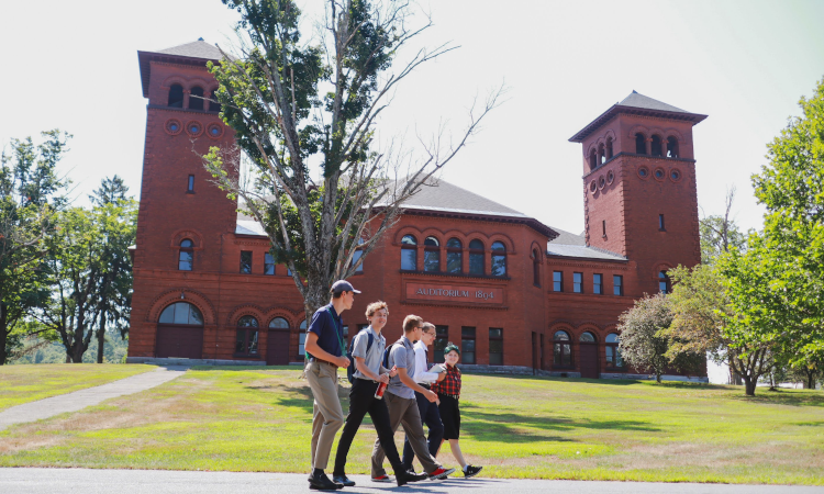 Students walk past the Moody Auditorium