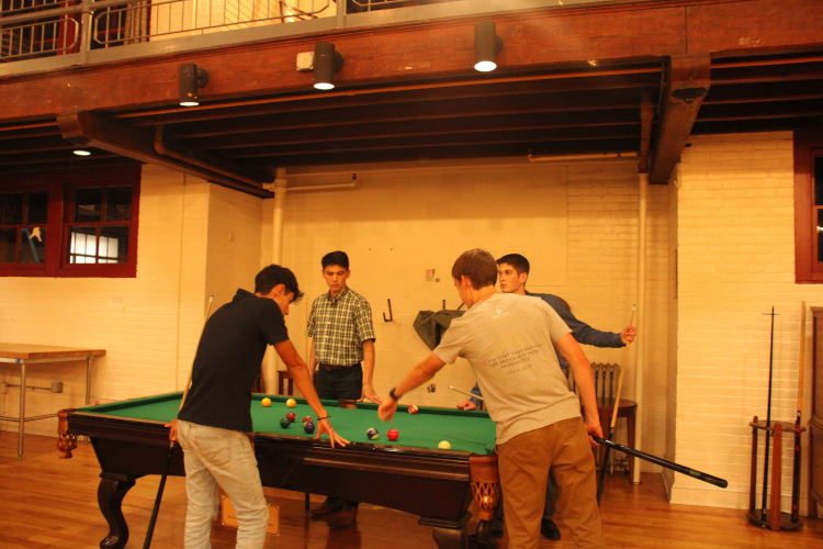 Students play pool