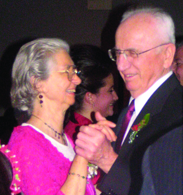Mr. and Mrs. Kraychy dance at the December 2008 wedding of their granddaughter Adrienne (Sauder) Rivera ’02.