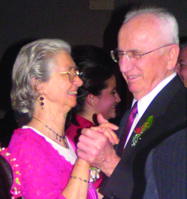 Mr. and Mrs. Kraychy dance at the 2008 wedding of their granddaughter Adrienne (Sauder) Rivera ’02.