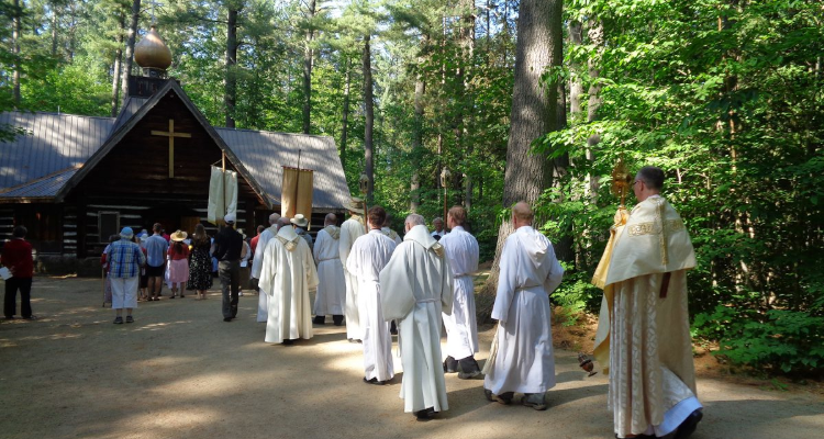 A procession of the Blessed Sacrament toward the Madonna House
