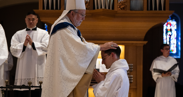 The Bishop performs the rite of ordination