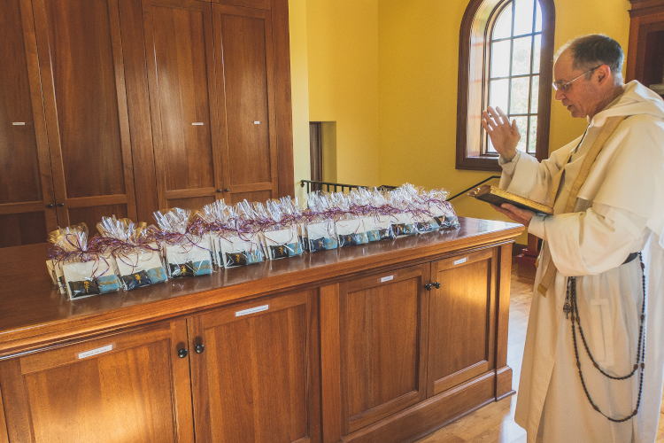 California Head Chaplain Rev. Paul Raftery, O.P., blesses the medals and the Rosaries that will be distributed at the California President’s Dinner on Wednesday.
