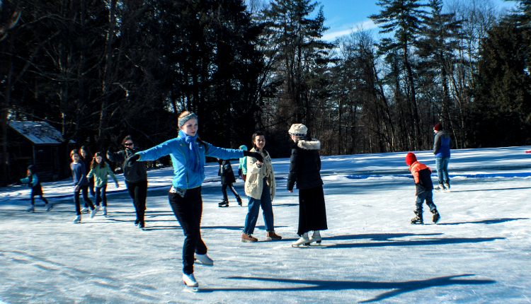 Siobhan Heekin-Canedy (’18) leads an ice-skating clinic on a campus pond.