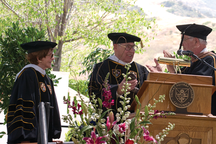 Chairman of the Board of Governors R. James Wensley inducts Mr. and Mrs. Sneed into the Order of St. Albert at Commencement 2009.