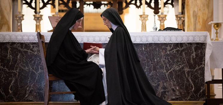 Sr. Maria Johanna Barrett kneels before the Superior