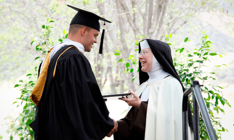 Sr. Regina Marie Gorman with a graduate at 2015